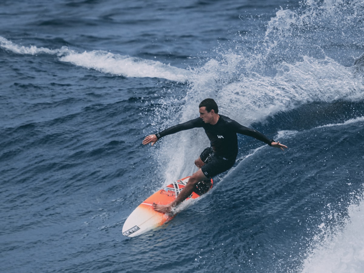 Surfer driving down the line on a mid-length